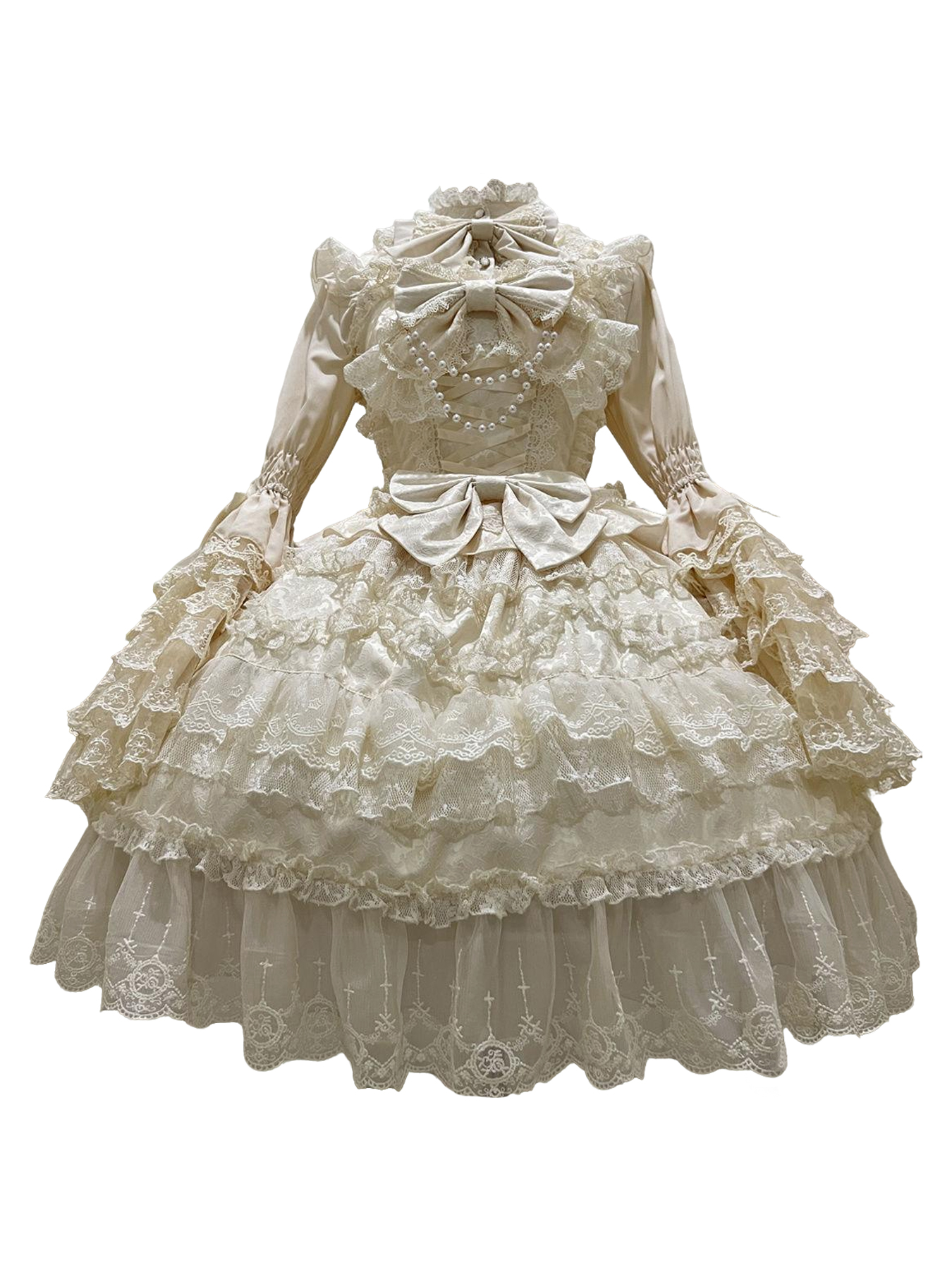 Elaborate cream Lolita dress with lace, ruffles, bows, and pearl details.